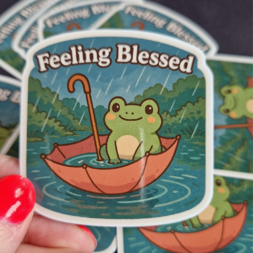 Sticker. "Feeling Blessed". Gullig groda i paraply.