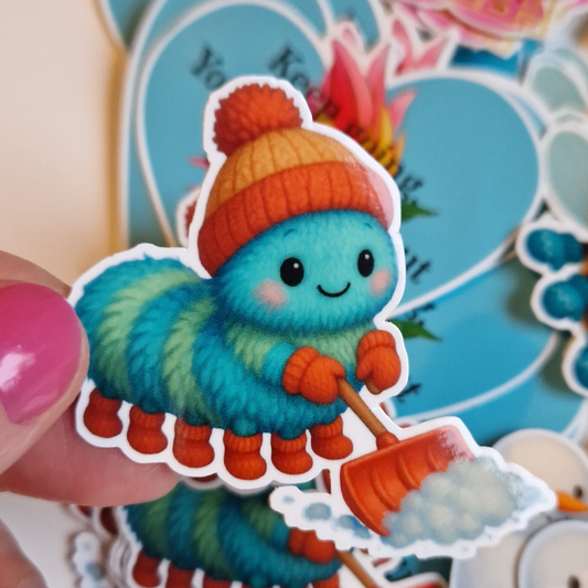 Sticker.Gullig vinter-larv som skottar snö.